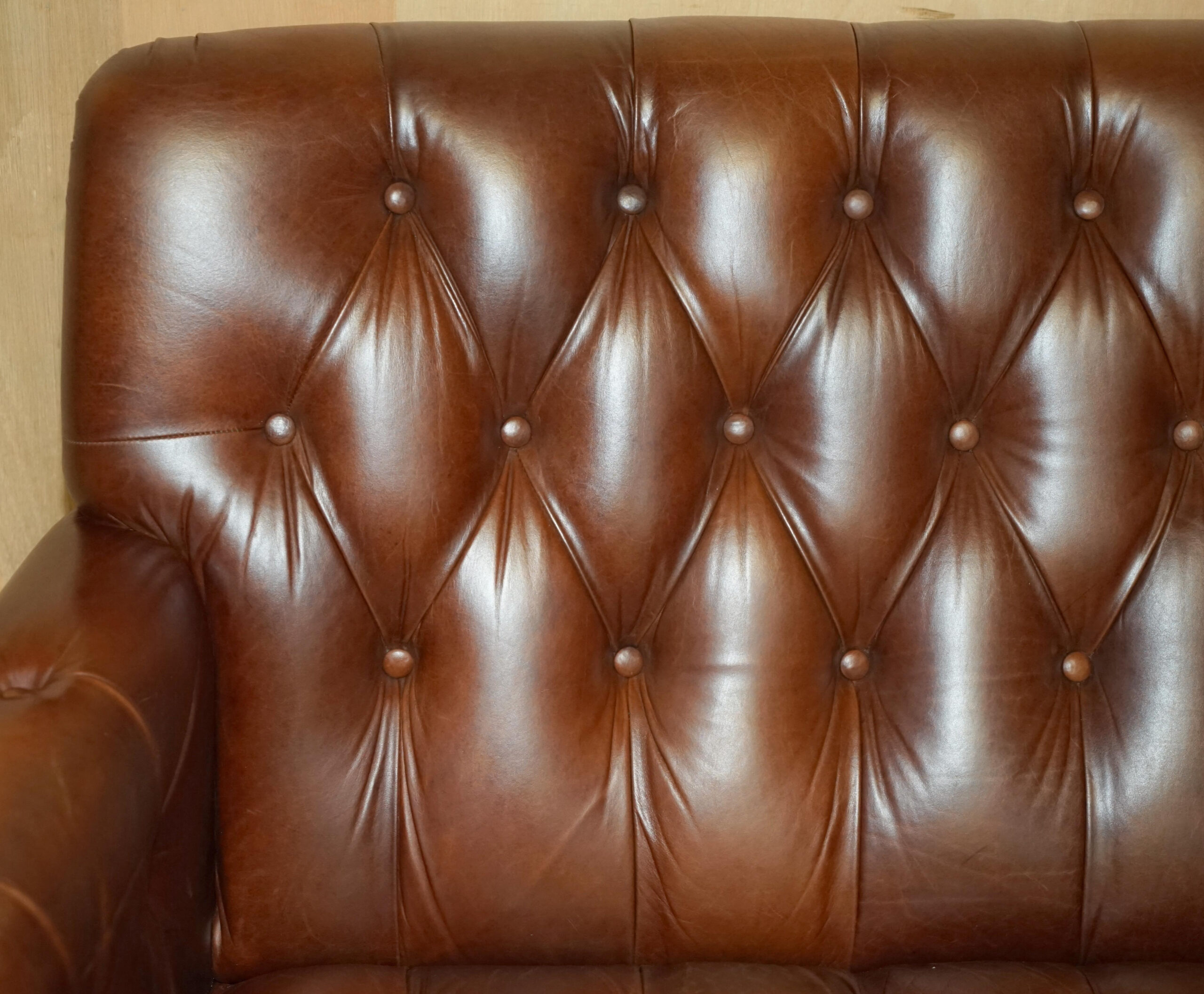 Weaving Comfort and Style A Chestnut Brown Leather Sofa for Artisans