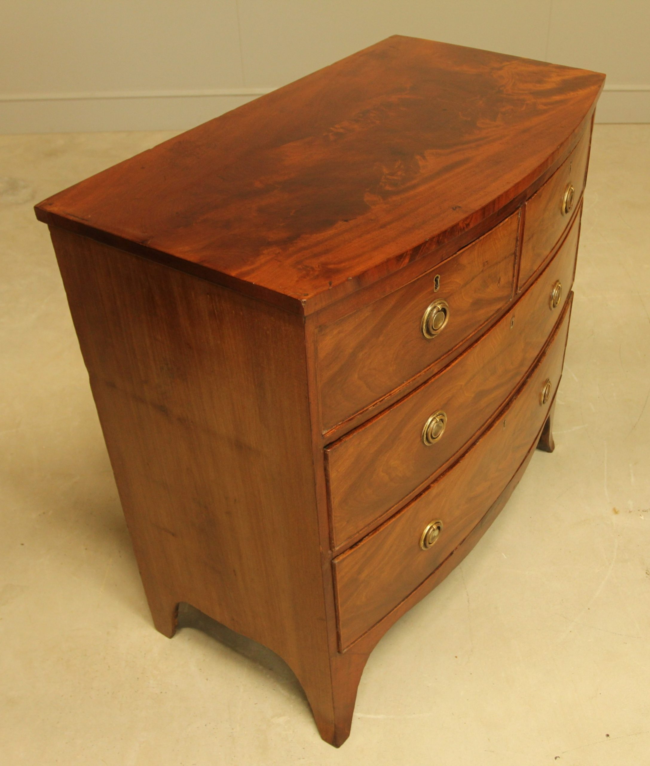 A Regency Bow Front Chest Of Drawers. in How Neoclassical Design Shaped the Elegant Curves of Regency Bow Front Cupboards